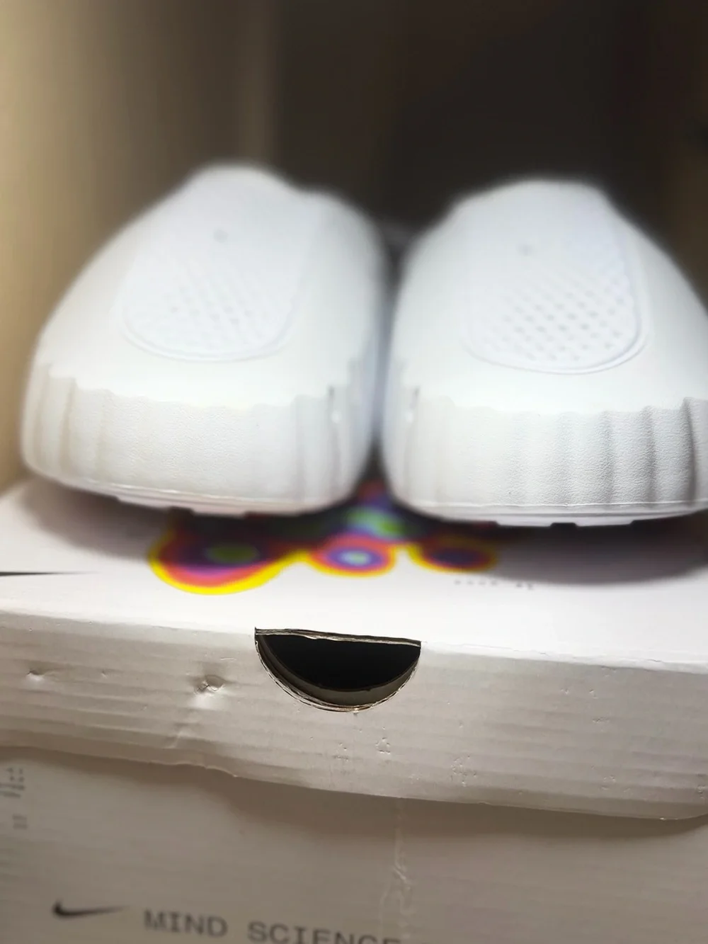 Nike Kids White Slip-On Slide with Black Swoosh Accent